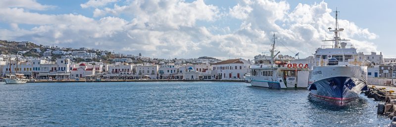 A boat cruises near the small island of Rhenia in the Aegean Sea near Mykonos.