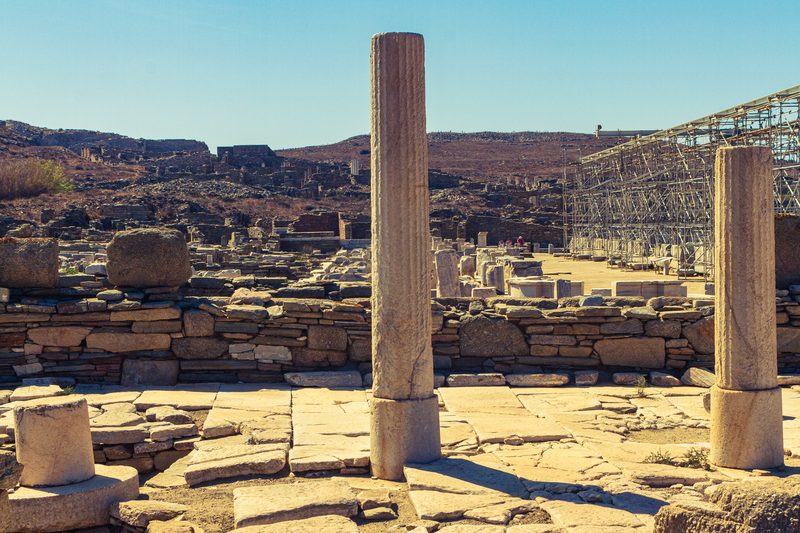 A serene view of the ancient ruins of Delos, an archaeological site in Greece.