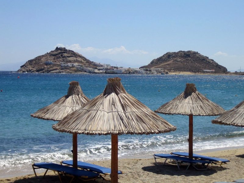 A sandy beach with clear blue waters at Kalafatis Beach.