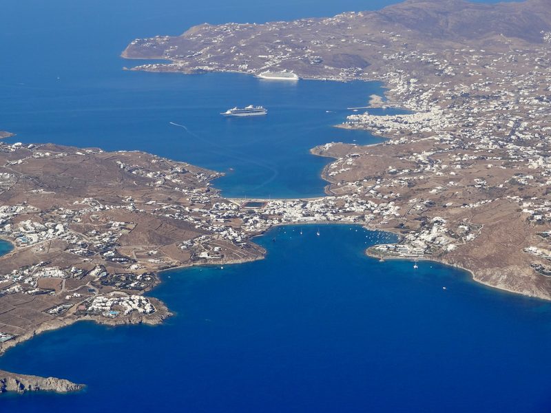 Aerial view of Ornos Beach on Mykonos, Greece, showcasing its sandy shore and clear waters.