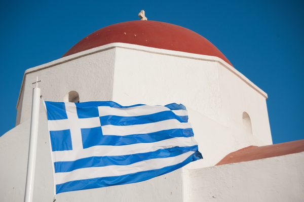 The rocky Mykonos coastline with clear blue water perfect for snorkeling